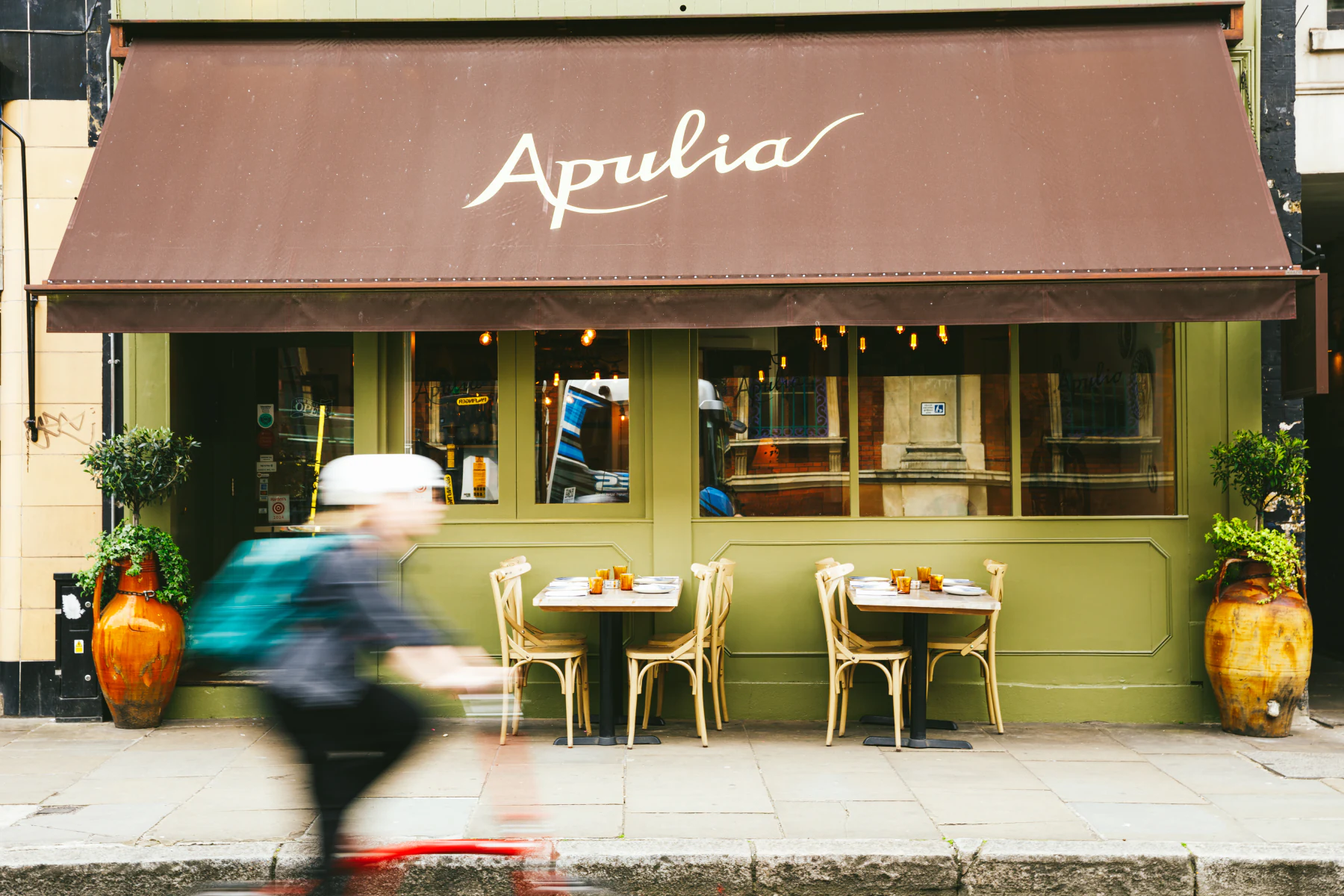 Apulia's green storefront on Long Lane with pavement tables